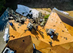 Roofer replace shingle that has been damaged and needing replacement of residential building - Timothy Parks Roofing & Construction Inc Roofer replace shingle that has been damaged and needing replacement of residential building
